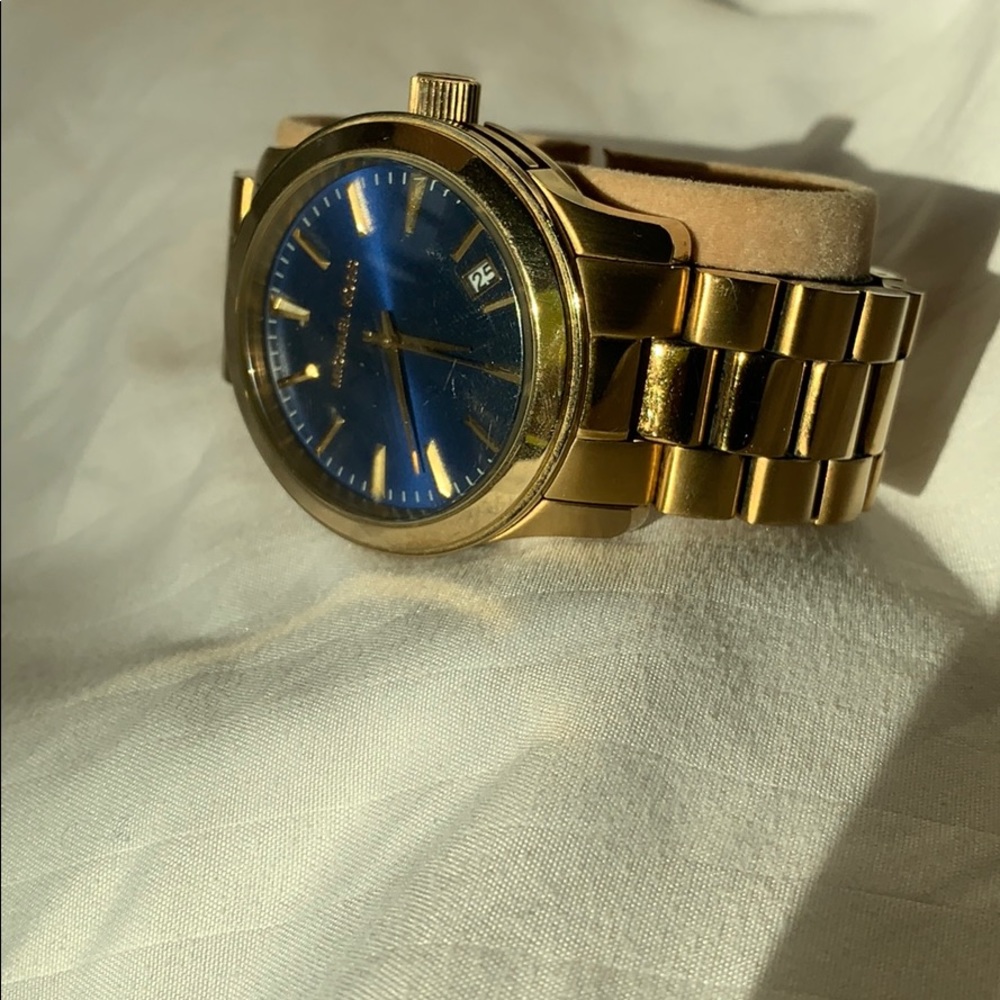 Used gold Michael Kors watch with a blue face
